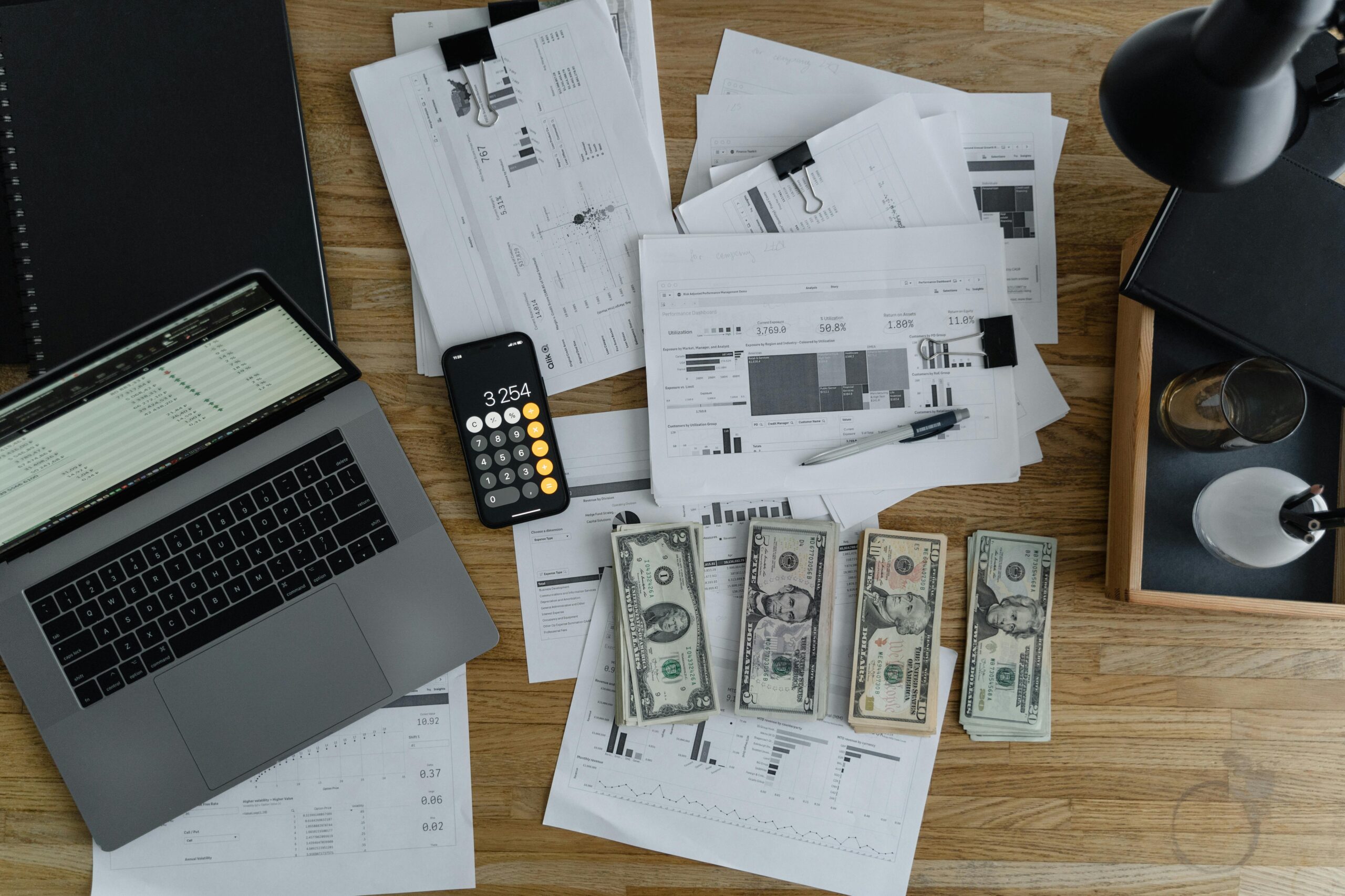 Ongoing payroll support processing with payroll documents, calculator, and financial tools