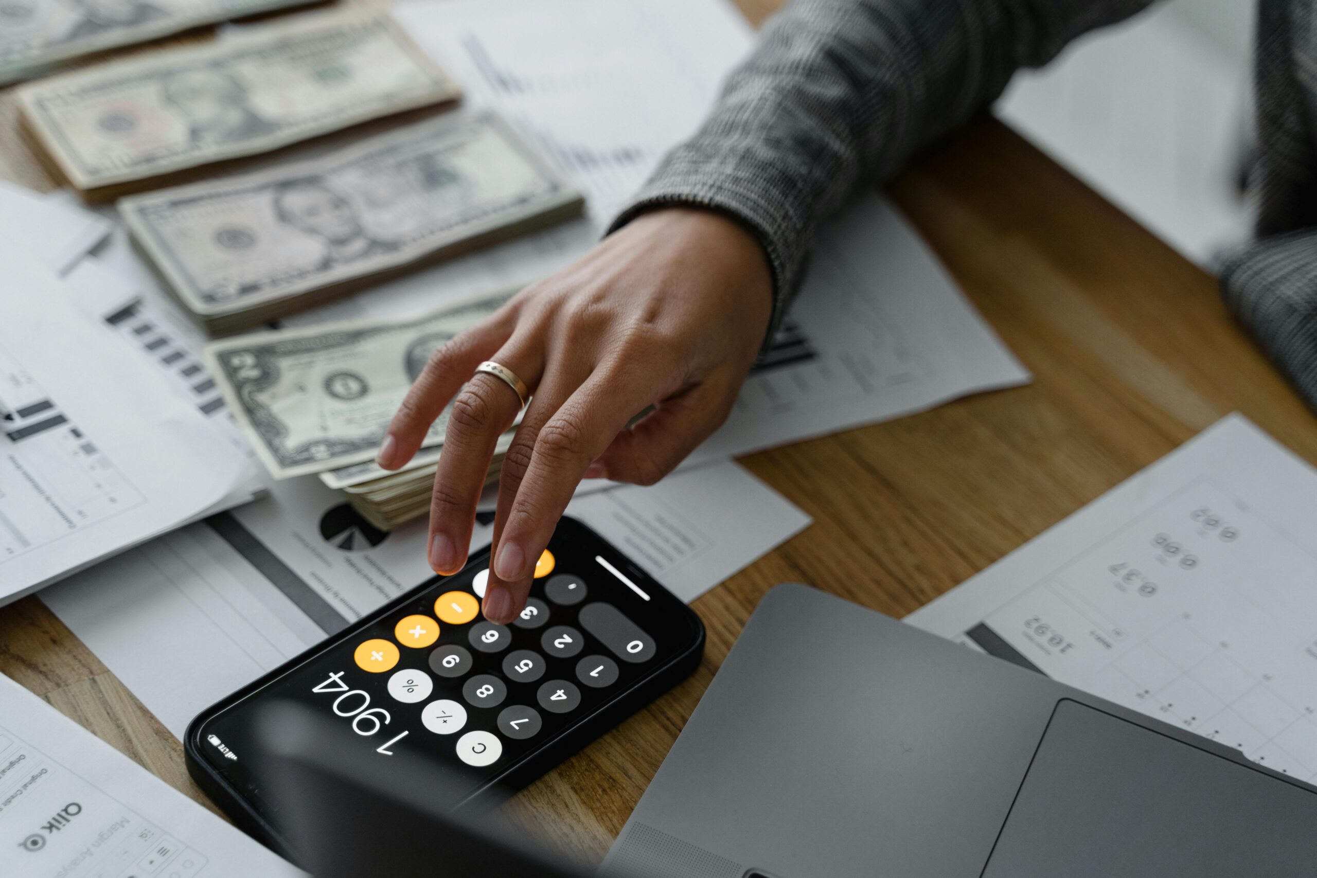 calculator and money representing bookkeeping concord nc